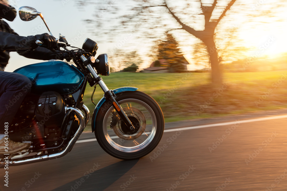 Motorcycle driver riding in European road