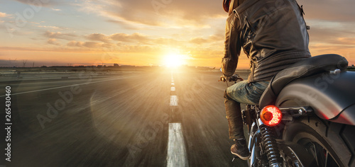 Fotografie, Obraz Motorcycle driver riding alone on asphalt motorway