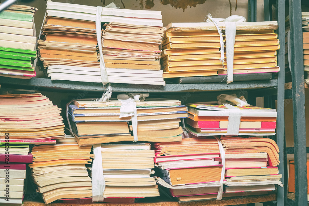 Old books in stacks on the shelf Old books in stacks on the shelf