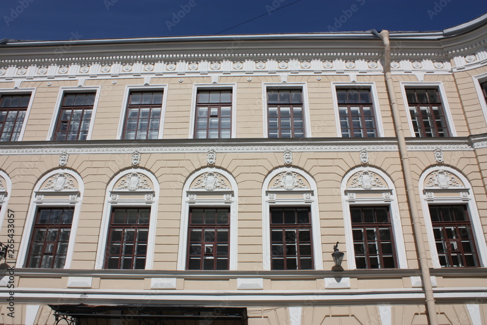 facade of the building with bas-reliefs and ornaments facade of the building with bas-reliefs and ornaments
