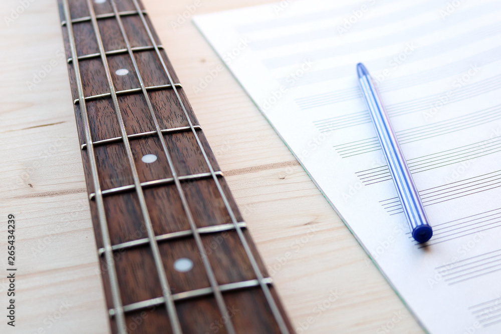 Fototapeta premium bass guitar and notepad