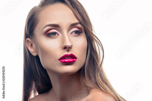 Glamour portrait of young beautiful fashion woman posing with professional makeup and hairstyle. Fashion brunette girl over white background.