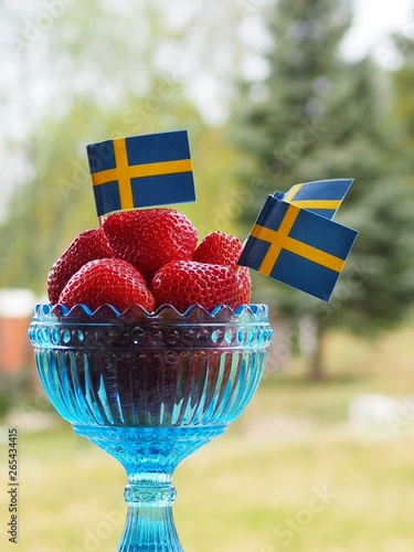 Strawberries with swedish flags for Swedens National Day or Midsummer