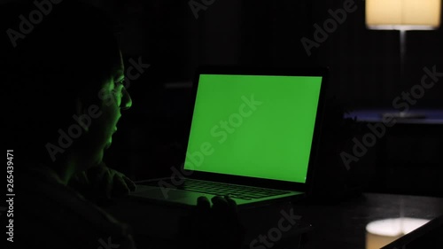 Wallpaper Mural Mother and son looking on laptop green screen at home. Torontodigital.ca