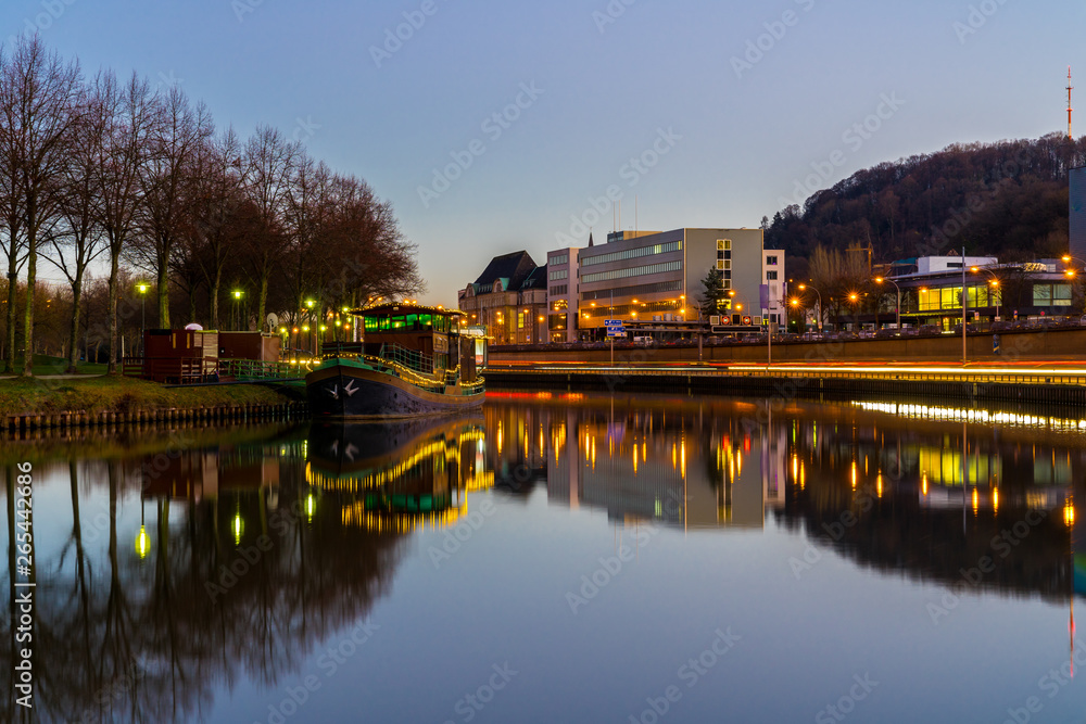 Germany, Traffic and street lights reflecting in silent water of saarbrucken in magic hour Germany, Traffic and street lights reflecting in silent water of saarbrucken in magic hour