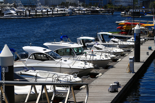 Bilde på lerret Small motor boat moored to the marina pier