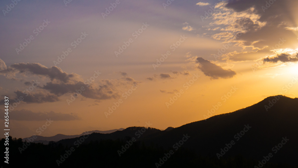 Beautiful landscape in the mountains at sunset. View of colorful sky with amazing clouds. Beautiful landscape in the mountains at sunset. View of colorful sky with amazing clouds.