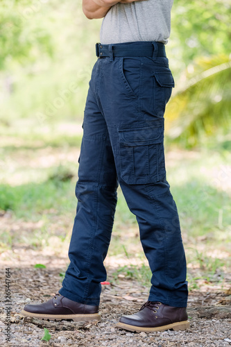 Model wearing blue   color cargo pants or cargo trousers © PRASERT