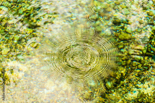 Circles on the surface of the reservoir as a background
