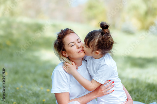 Portrait Of Mother And Daughter In Park.