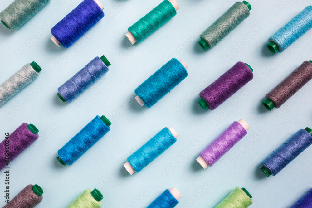 Pattern composition with sewing threads on color background Pattern composition with sewing threads on color background