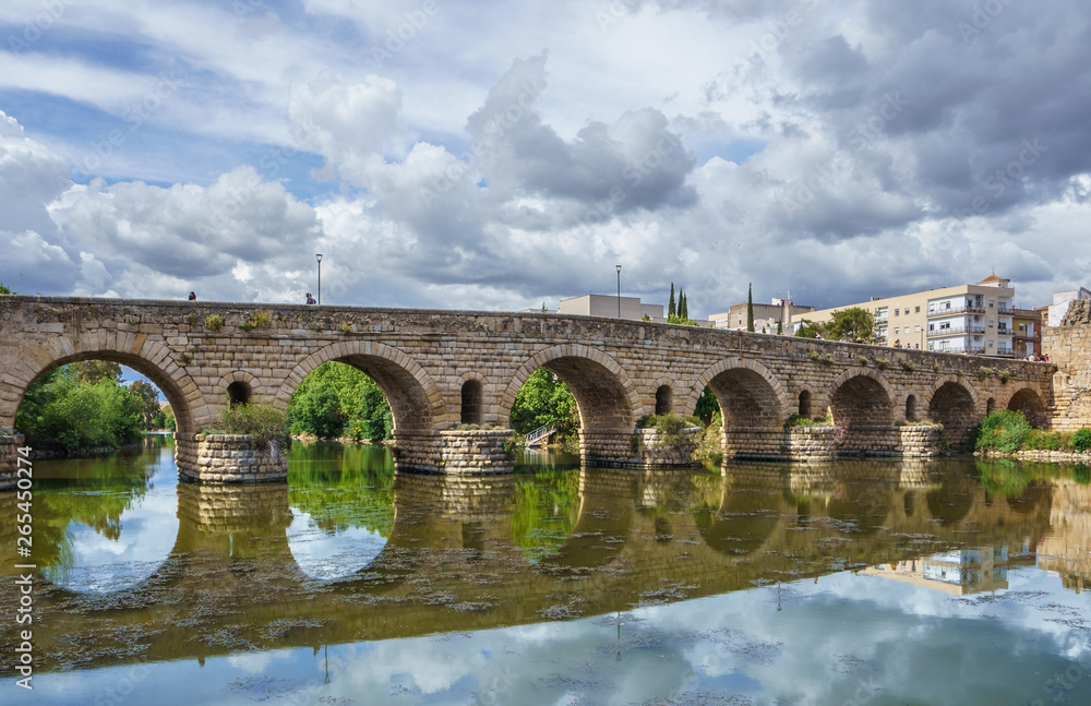 View of the Roman bridge of Merida with its reflection on the Guadiana river. Merida. Spain.The Archaeological Ensemble of Merida is declared a UNESCO World Heritage Site Ref 664 View of the Roman bridge of Merida with its reflection on the Guadiana river. Merida. Spain.The Archaeological Ensemble of Merida is declared a UNESCO World Heritage Site Ref 664