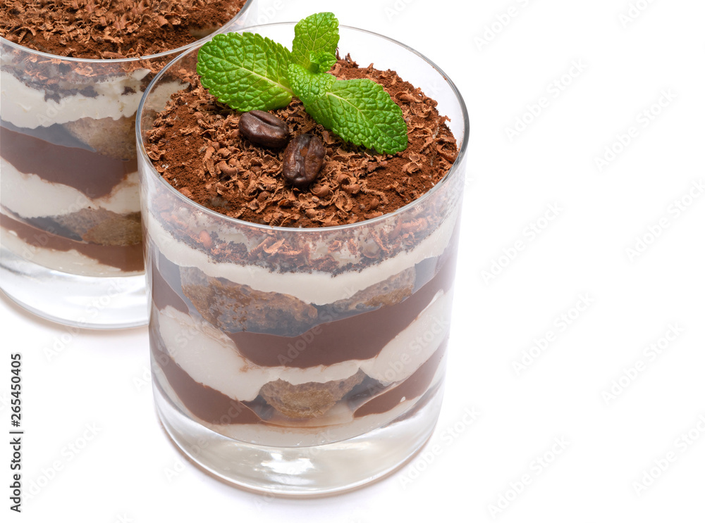 two portions Classic tiramisu dessert in a glass isolated on a white background with clipping path two portions Classic tiramisu dessert in a glass isolated on a white background with clipping path