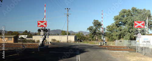 double level Railway crossing over a tar road in an industrial area in a small town, rural New South Wales, Australia