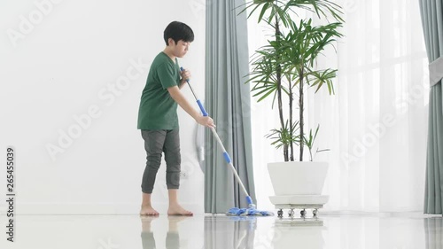 Wallpaper Mural Asian young boy help family cleaning the house using a mop. Torontodigital.ca