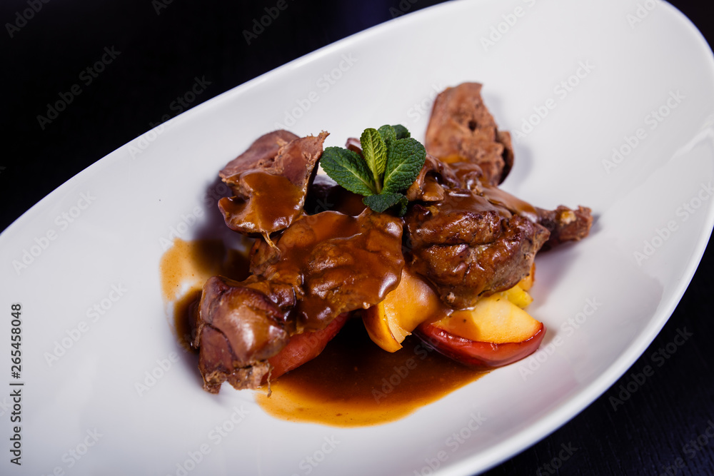 Duck liver with berry sauce and apples decorated with rosemary Duck liver with berry sauce and apples decorated with rosemary