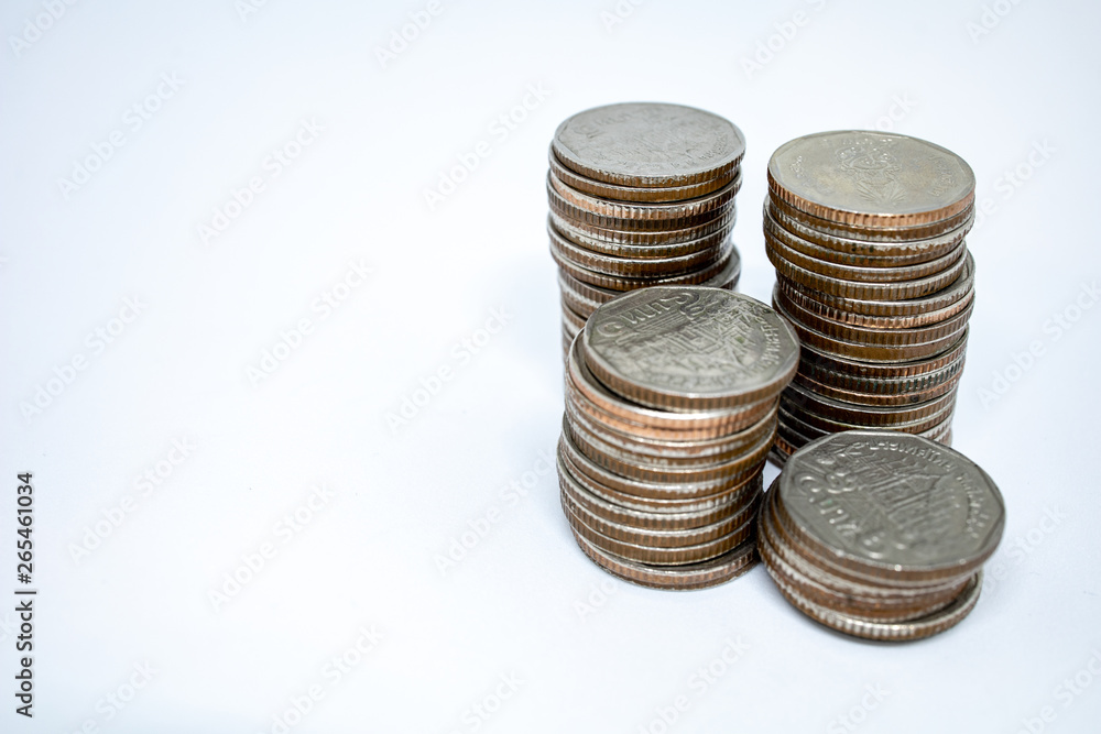 Currency in Thai baht with silver coins on white background. Abstract of saving money Currency in Thai baht with silver coins on white background. Abstract of saving money