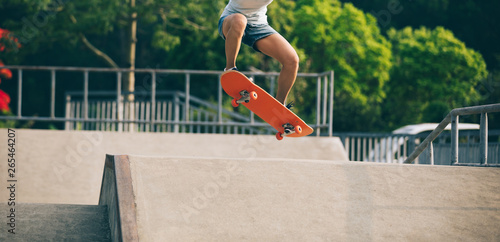 skateboarder skateboarding on skatepark ramp