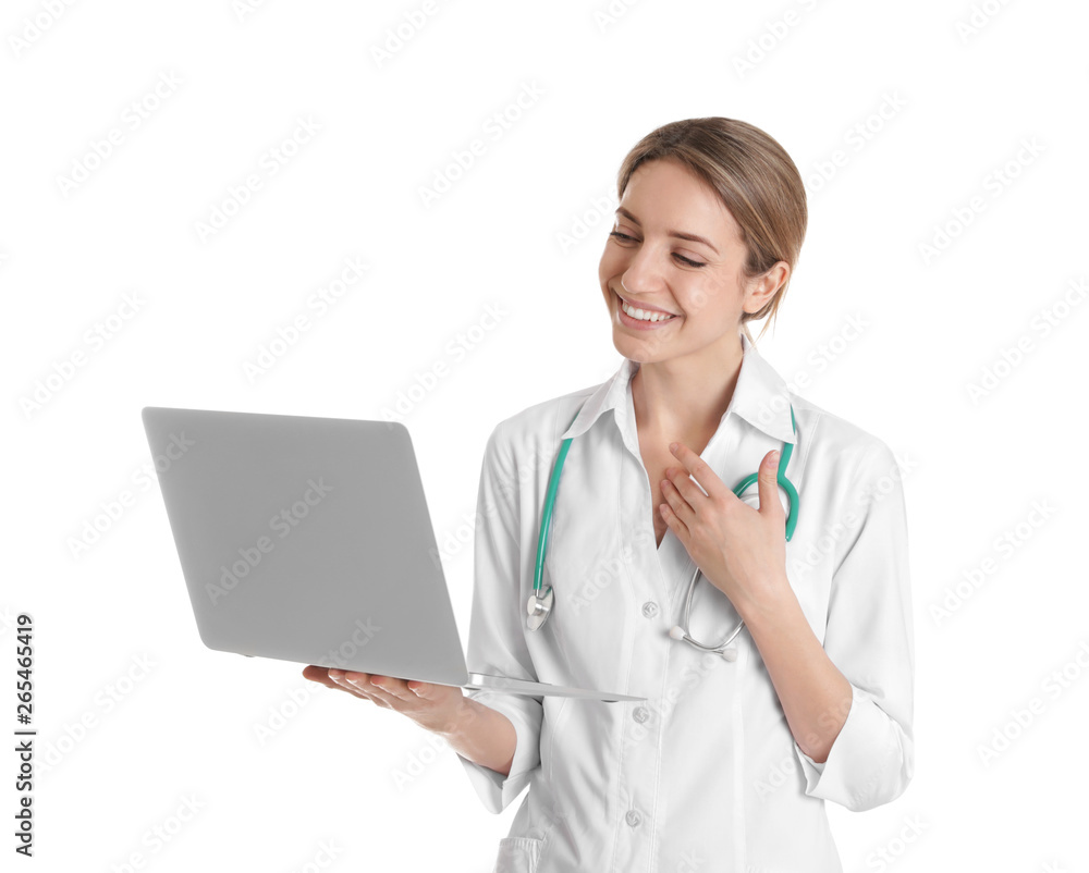 Female doctor using video chat on laptop against white background Female doctor using video chat on laptop against white background