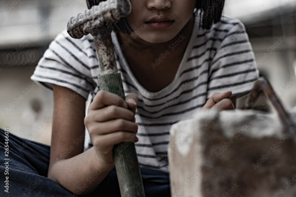 International human rights day concept. Poor little girl working at construction site