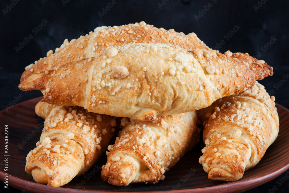Fresh pastries, a plate with delicious croissants Fresh pastries, a plate with delicious croissants