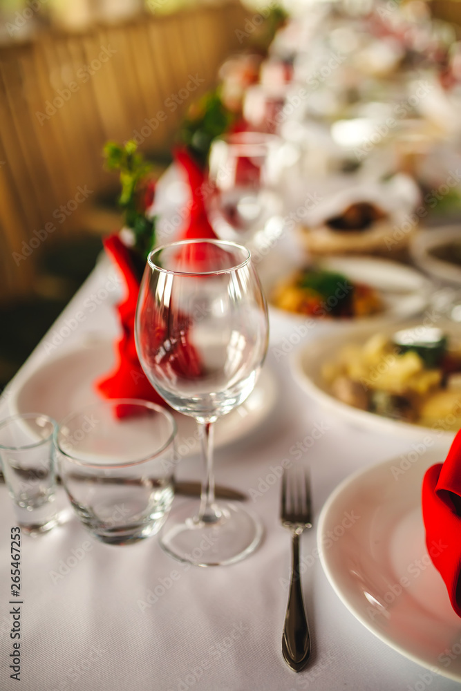 Restaurant interior, serving, wine and water glasses, plates. Concept banquet, birthday, conference, group lunch Restaurant interior, serving, wine and water glasses, plates. Concept banquet, birthday, conference, group lunch