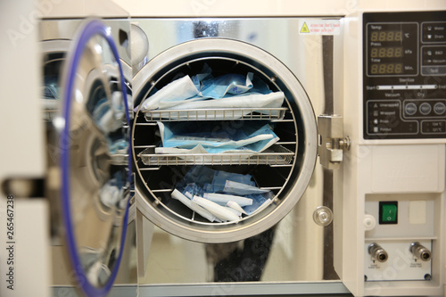 Disinfection of instruments in the machine in the dental clinic. Tools for dental treatment
