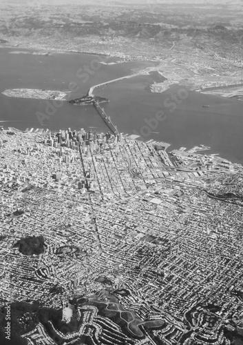 View from an airplane window on San Francisco and Oakland with the Bay Bridge in Black and White photo