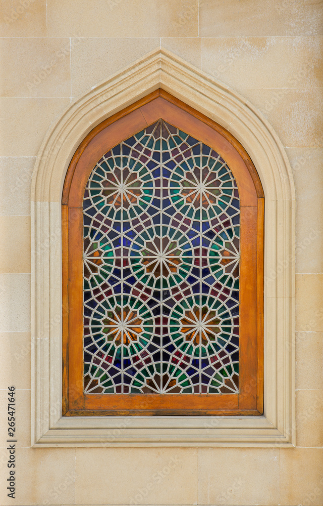Ornamental ancient style window with colorful stained glass