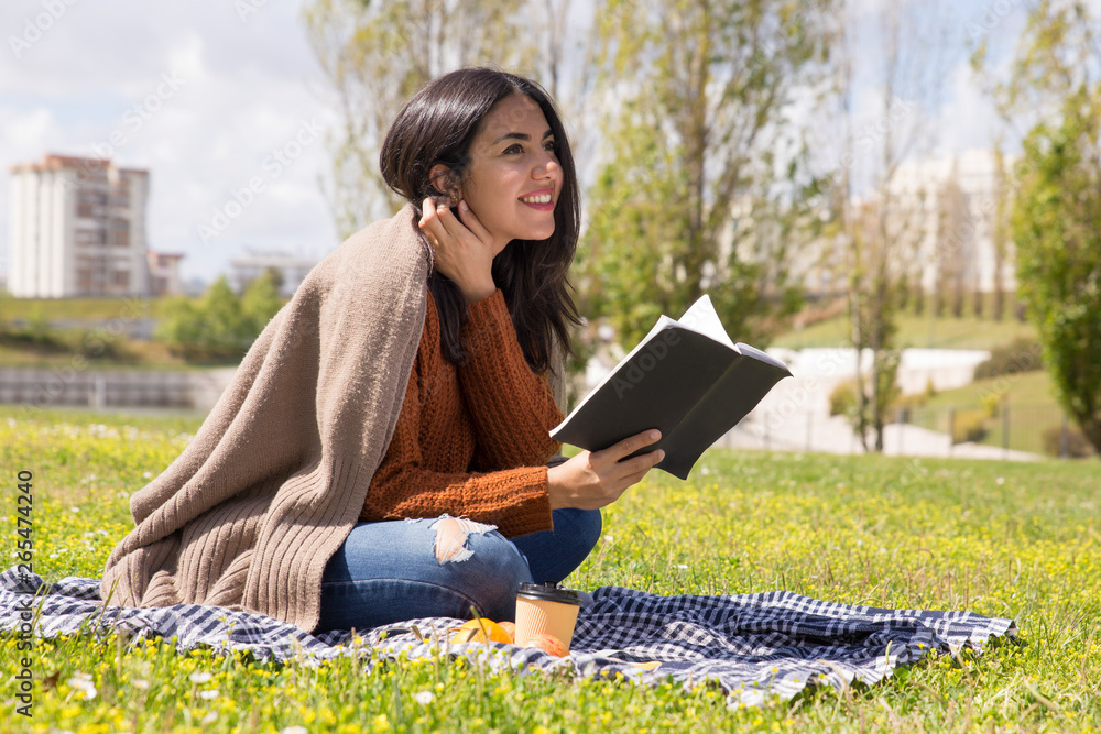 Fototapeta premium Cheerful student girl studying her notes