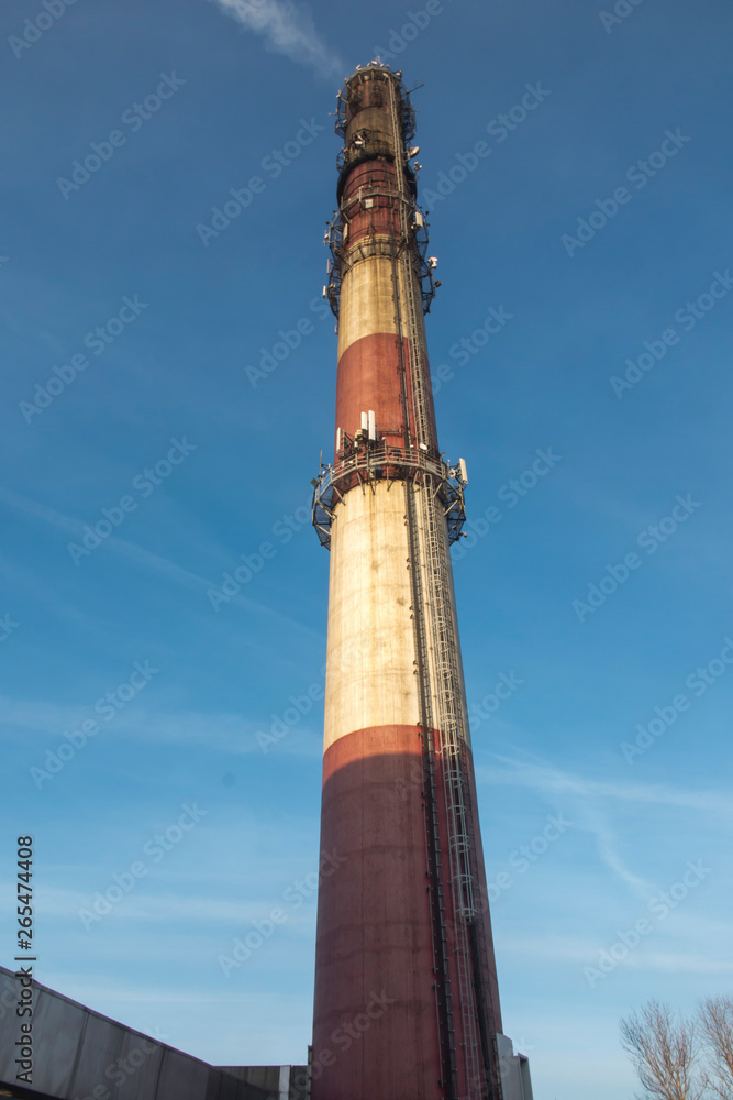 industrial white, red, high concrete chimney industrial white, red, high concrete chimney