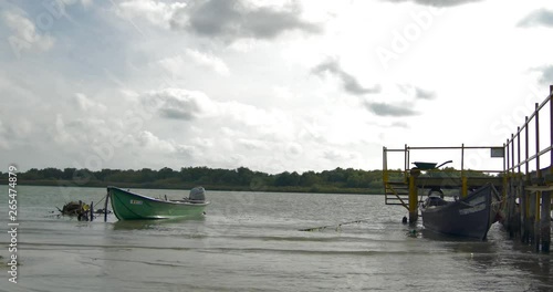 Boats in Danube Delta, ponton from Sfantu Gheorghe, Romania photo