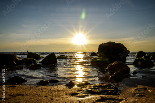 tropical beach short before sunset time with sunrays photo