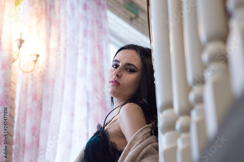 beautiful young brunette walks resting in a restaurant.