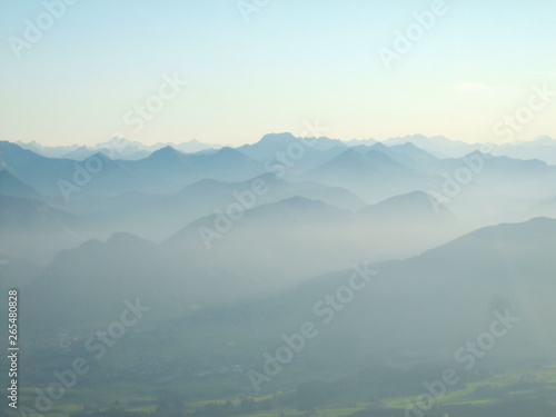 Air plane view on alps in the morning haze during dawn
