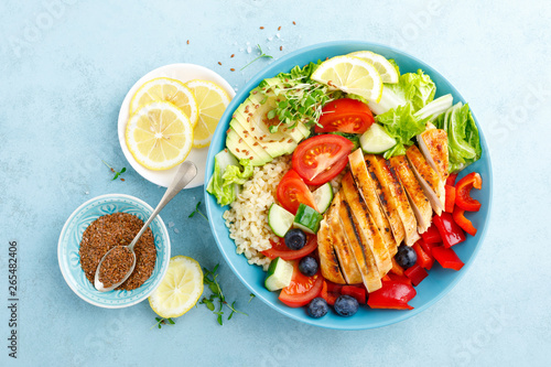 Lunch bowl with grillet chicken breast, fillet, bulgur and fresh vegetable salad photo