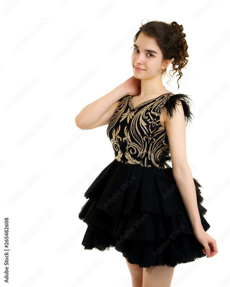 A teenage girl in a short dress. A teenage girl in a short dress.