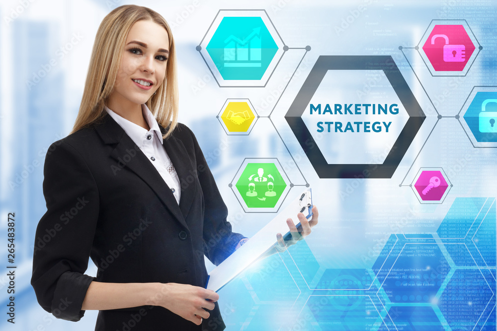 The concept of business, technology, the Internet and the network. A young entrepreneur working on a virtual screen of the future and sees the inscription: marketing strategy The concept of business, technology, the Internet and the network. A young entrepreneur working on a virtual screen of the future and sees the inscription: marketing strategy