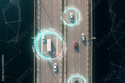 4k aerial view of self driving autopilot cars driving on a highway with technology tracking them, showing speed and who is controlling the car. Visual effects clip shot. photo
