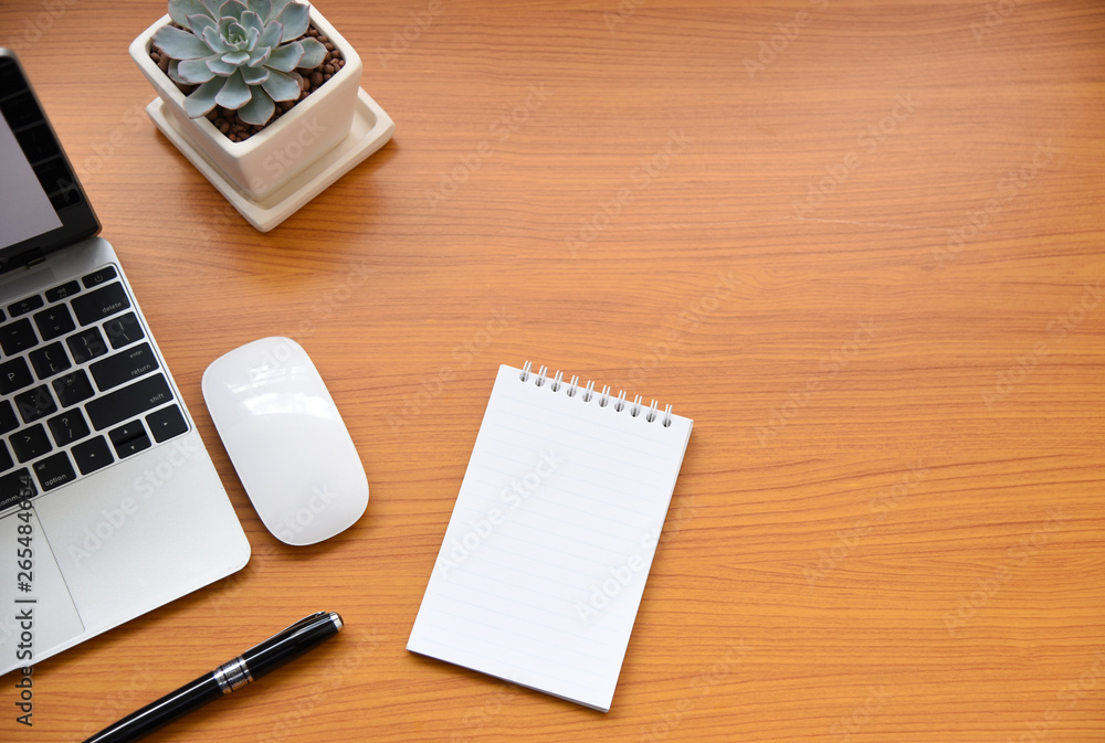 Office table with keyboard,mouse,Notebook,pen and cactus, copy space,Top view, flat lay,minimal style Office table with keyboard,mouse,Notebook,pen and cactus, copy space,Top view, flat lay,minimal style