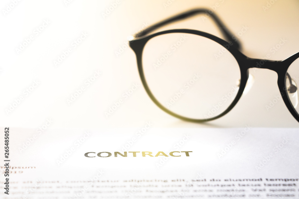 contract paper and glasses in business work on office desk contract paper and glasses in business work on office desk