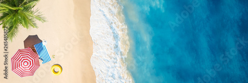 Aerial view of umbrella,towel on sand beach