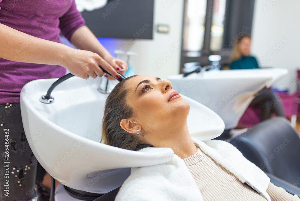 Portrait of women which wash hair in a beauty salon Portrait of women which wash hair in a beauty salon