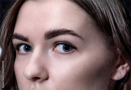 The face of a young girl shot close-up. Expressive eyes.