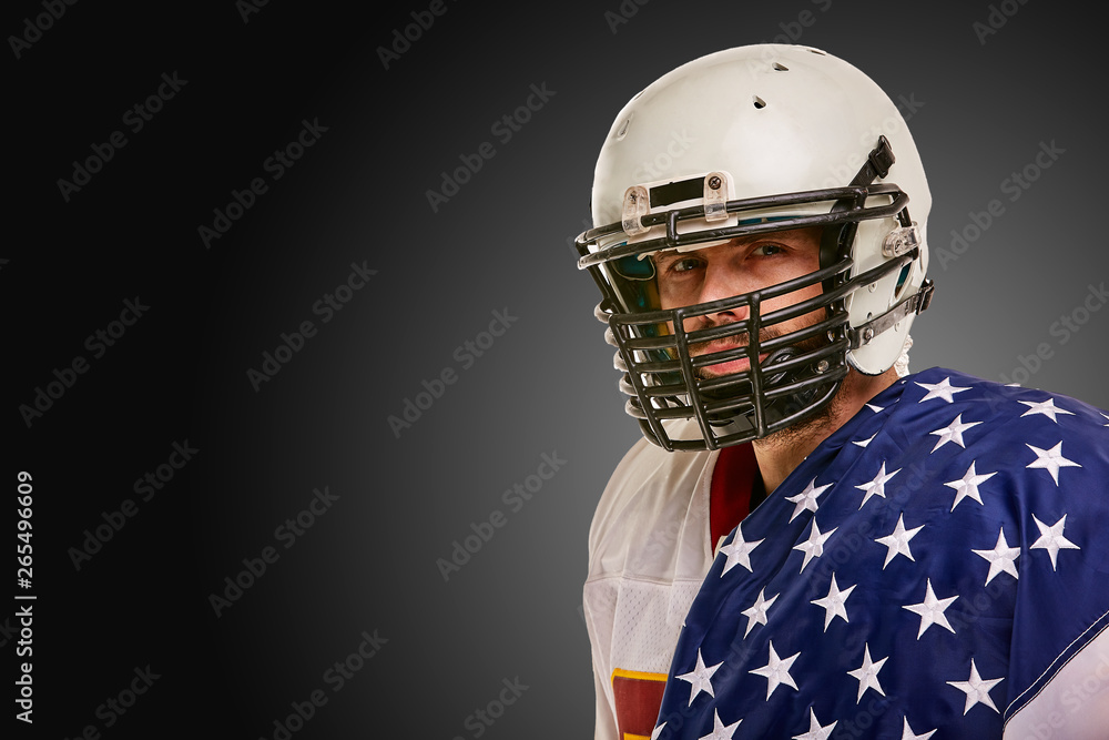american Football Player with uniform and american flag proud of his country, on a white background. american Football Player with uniform and american flag proud of his country, on a white background.