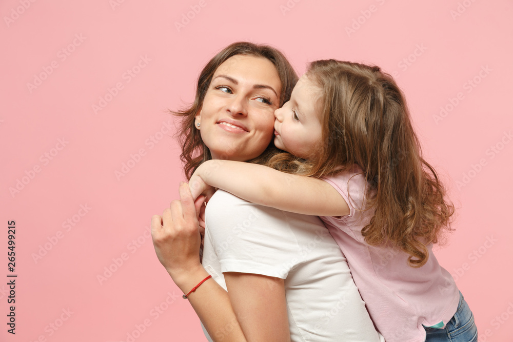 Woman in light clothes have fun with cute child baby girl. Mother, little kid daughter isolated on pastel pink wall background, studio portrait. Mother's Day, love family, parenthood childhood concept Woman in light clothes have fun with cute child baby girl. Mother, little kid daughter isolated on pastel pink wall background, studio portrait. Mother's Day, love family, parenthood childhood concept