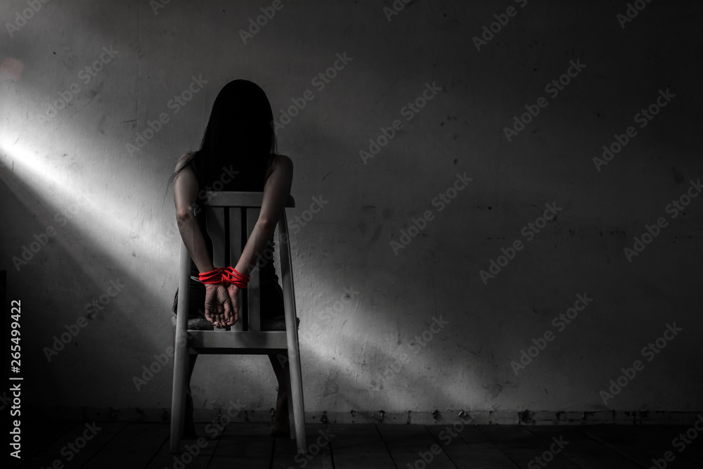 1000px x 667px - Young woman sitting on chair and tied up with rope ,Victim woman tied with  red rope