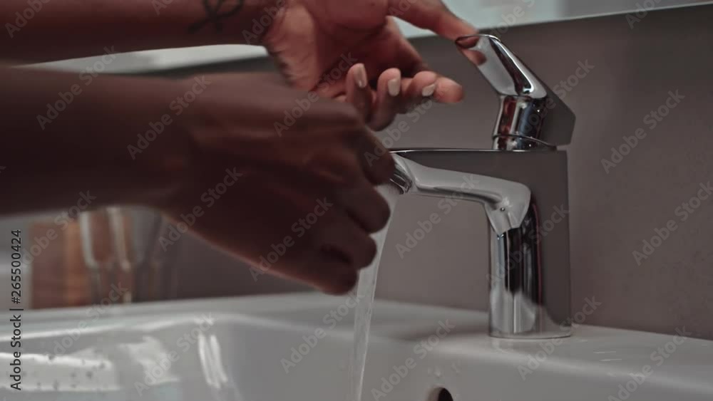 Washing hands in bath Washing hands in bath