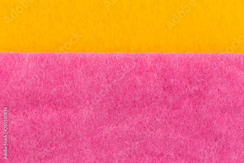 Texture of yellow pink washcloths macro close-up background with close range.