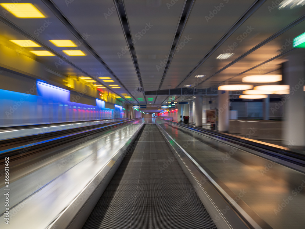 Long Exposure moving walkway with neon light at underground Long Exposure moving walkway with neon light at underground